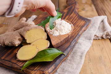 Ginger and lemon on a wooden background, Photo in a rustic style. Ingredients for warming and health drink. Alternative medicine. Free space for text