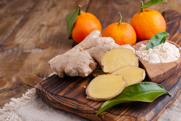 Ginger and lemon on a wooden background, Photo in a rustic style. Ingredients for warming and health drink. Alternative medicine. Free space for text