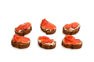 Salmon on a bread with cream isolated on white.
