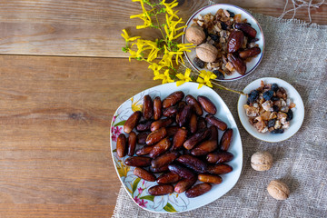 bowl of mixed dry fruits and nuts on wooden table