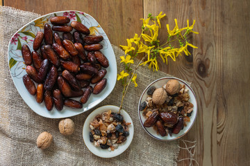 bowl of mixed dry fruits and nuts on wooden table