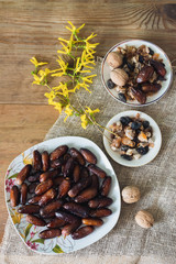bowl of mixed dry fruits and nuts on wooden table