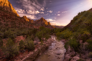 Watchman mountain in Zion national park stand watch over the vista scene where the Virgin river runs peacefully through it. This amazing scene shows natures perfection in Utah near Nevada