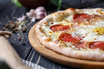 Aromatic pizza with egg and sausage. A fragment of pizza