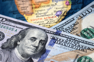 Obraz na płótnie Canvas US dollars on the South Africa map. American investment and trading, South African economy