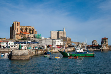 An old town port and a fishing boat