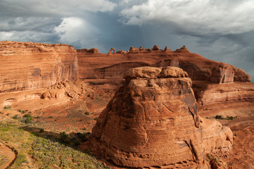 Fototapeta premium Arches national park view of Utah national monument from Wolfe ranch area viewpoint. The cliffs, structure and delicate arch landmark are shown from a rare viewpoint in UT near Moab. 