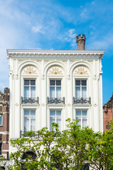Fototapeta na wymiar white decorative historical building in Utrecht, The Netherlands, against blue sky