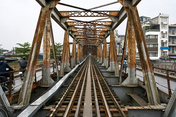 Old railroad bridge with rusty metal constructions