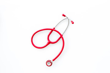 diagnostic and cure of cardiac disease with stethoscope on white background top view mock-up