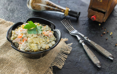 Traditional Russian Christmas and New year salad Olivier . Selective focus