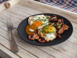 Fried eggs with bacon and smoked Turkey breast