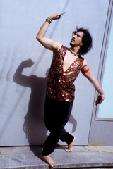Bollywood dancer with beard and black curly hair