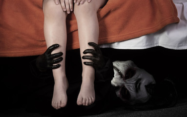 Little kid and monster under the bed. .Childhood fears concept. © rodjulian