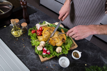 Tasty delicious food on wooden desk in kitchen. Grilled chicken or turkey with spices and fresh vegetables. Christmas or thanksgiving pay preparation