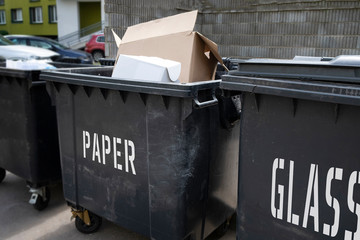 Black plastic trash containers for separate collection and sorting of garbage for environmental protection