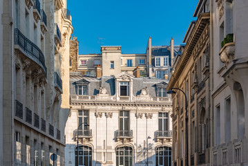 Fototapeta na wymiar Paris, ancient and modern buildings, typical parisian facades and windows