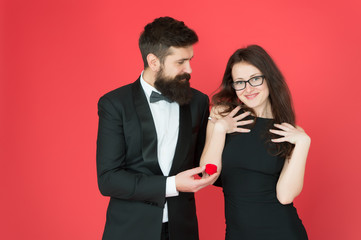 romantic valentines day. sexy couple in love. tuxedo man and elegant lady at engagement party. formal couple. ring in box. bearded man make woman marriage proposal. love romantic date and romance