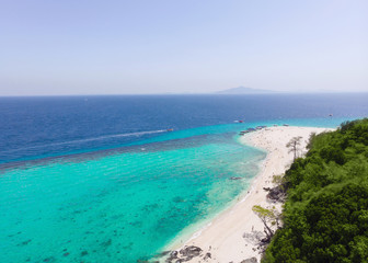 Fototapeta na wymiar Aerial view of the beach on an island in the blue ocean