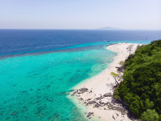 Fototapeta na wymiar Aerial view of the beach on an island in the blue ocean