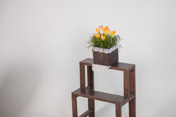 flowers in a vase on wooden table