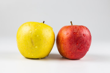 close up view of a Red and yellow apple fruits over white background