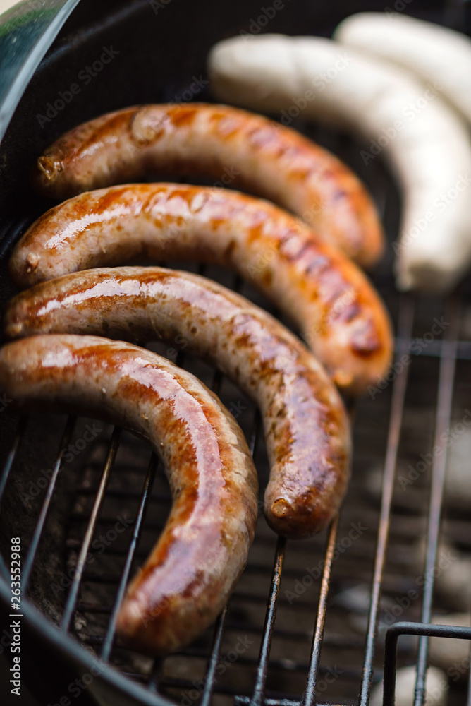 Poster grilled sausages on grill