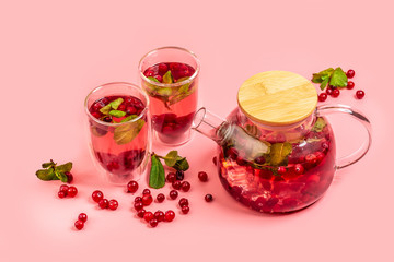 Detox Infused Water with Cranberries and Mint, living coral background. space for text