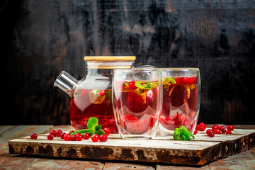 Trendy detox healthy drink. Detox water with cranberrie, mint on a wooden table. Summer drink, lemonade. Diet. Flat lay. Top view. Copy space