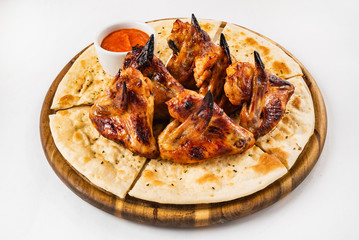 tasty grilled chicken wings with sauce