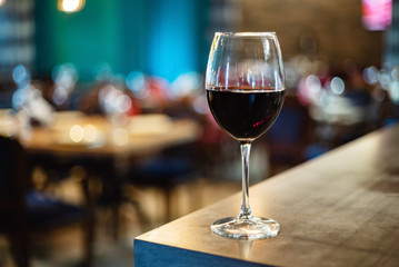 Fototapeta red wine glass in the restaurant obraz