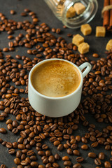coffee fresh and hot in a white cup, aroma. serving of beverage (coffee grain). food. top view. copy space