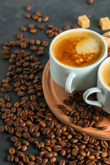 coffee fresh and hot in a white cup, aroma. serving of beverage (coffee grain). food. top view. copy space