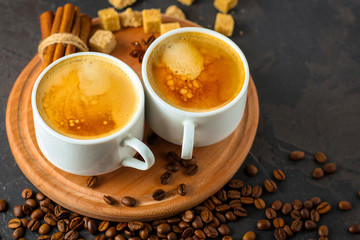 coffee fresh and hot in a white cup, aroma. serving of beverage (coffee grain). food. top view. copy space