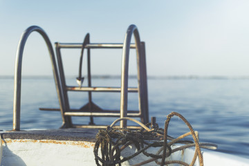 Ladder on the boat in the sea.