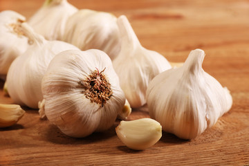Garlic Cloves and Bulb on vintage wooden table.