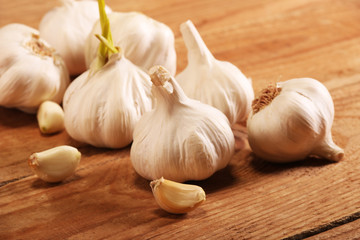 Garlic Cloves and Bulb on vintage wooden table.