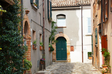 Fototapeta na wymiar Houses and windows of cozy city Santarcangelo di Romagna, Rimini, Italy