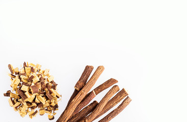Close up of Ayurvedic herb Liquorice root,Licorice root, Mulethi or Glycyrrhiza glabra root on a wooden surface is very much beneficial for Soothes your stomach,poisoning, stomach ulcers.