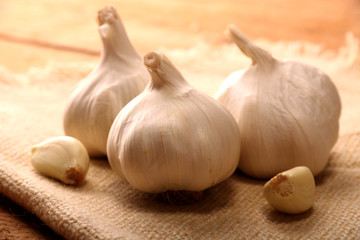 Garlic. sliced garlic, garlic clove, garlic bulb on vintage wooden table.