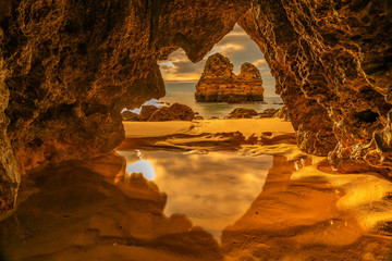 beautiful beach photographed from a cave - obrazy, fototapety, plakaty