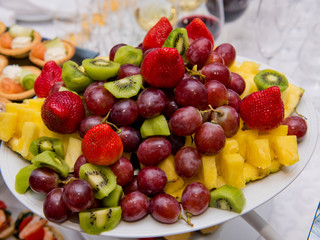 Fruit sliced on a plate.