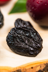 Dried Plums Pitted Prunes and Fresh Plums. Selective focus.