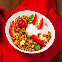 Strawberry Cinnamon Granola Yogurt Breakfast. Selective focus.