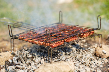 Meat rolls on grill