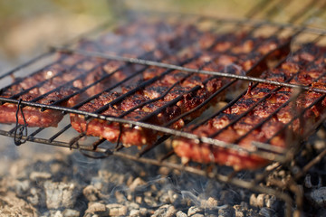 Meat rolls on grill