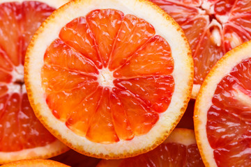Blood orange cut in circles on a dark background