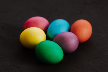 Colored easter eggs on a black background