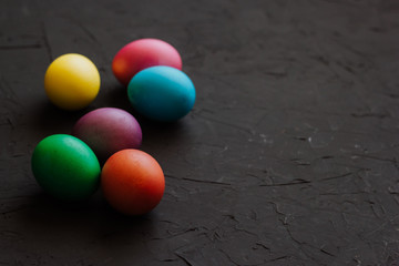 Colored easter eggs on a black background