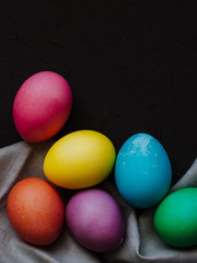 Colored easter eggs on a black background